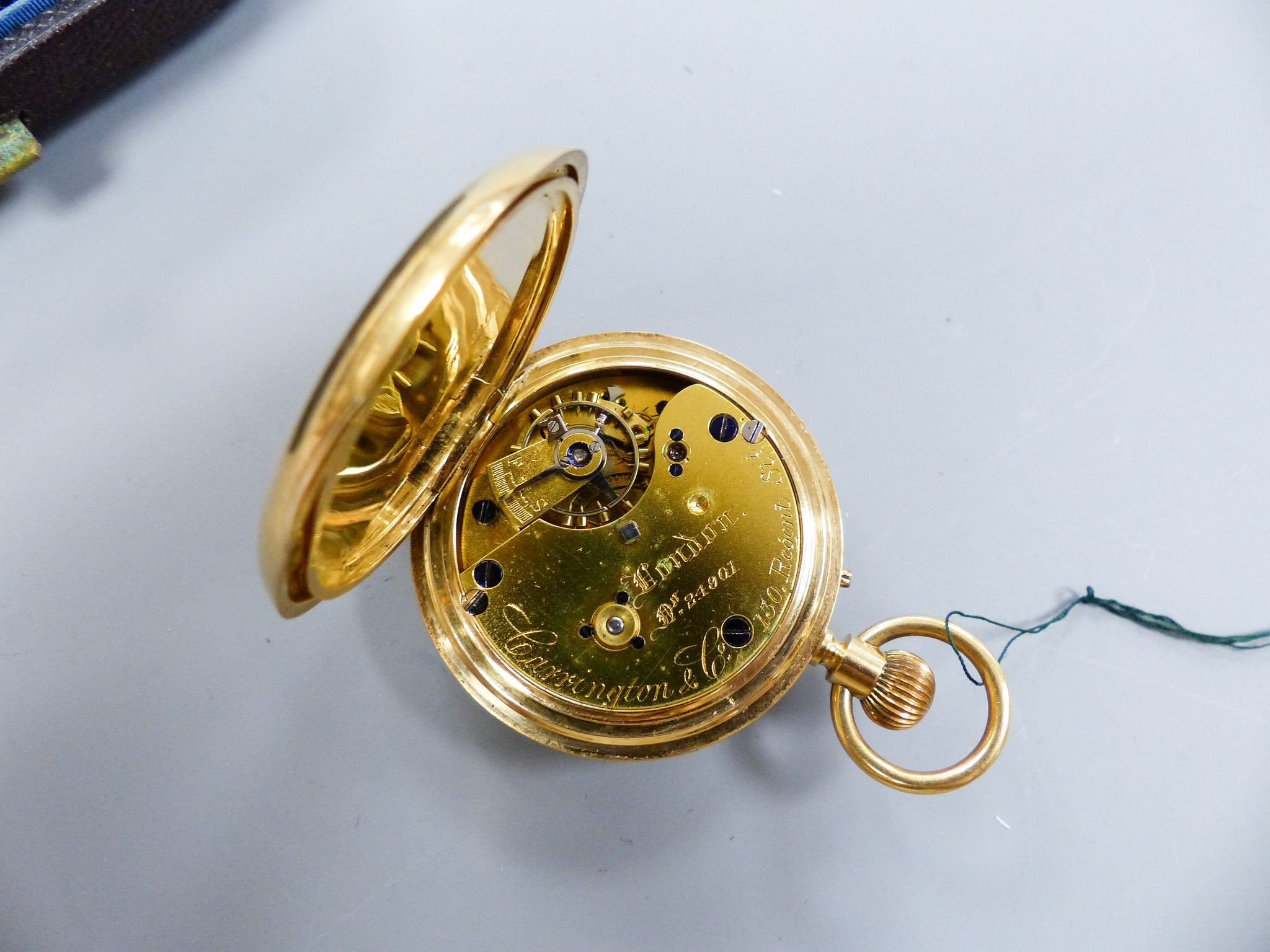 A cased late Victorian 18ct gold half hunter pocket watch, by Carrington & Co, with signed movement, case diameter 37mm, gross weight 62.1 grams, with key.